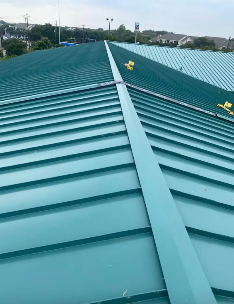 Green commercial metal roof ridge and valley for Metal Roof Repair in Excelsior Springs